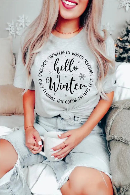 Hello Winter T-shirt featuring an applied Screen Print Transfer in black lettering. All shirts are Unisex adult-sized and crafted from 5.3 oz. 100% preshrunk cotton.
