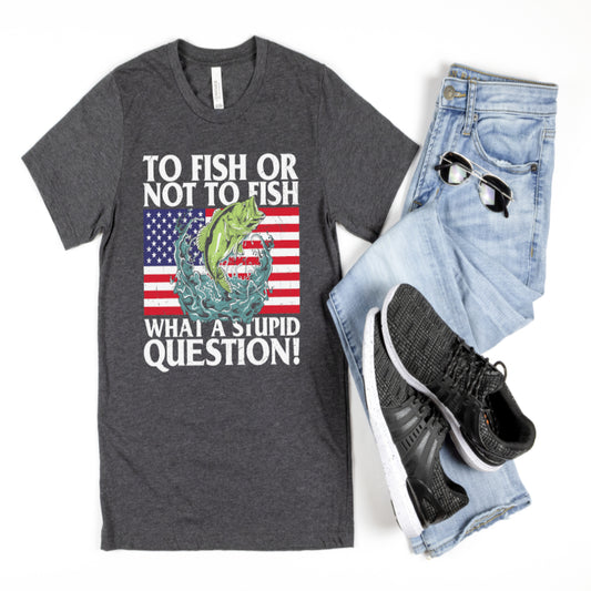 This T-shirt features a full-color screen print transfer with the words "To Fish Or Not To Fish - What A Stupid Question" printed on the front. The shirt is unisex adult sized, made with 5.3 oz. of 100% preshrunk cotton.